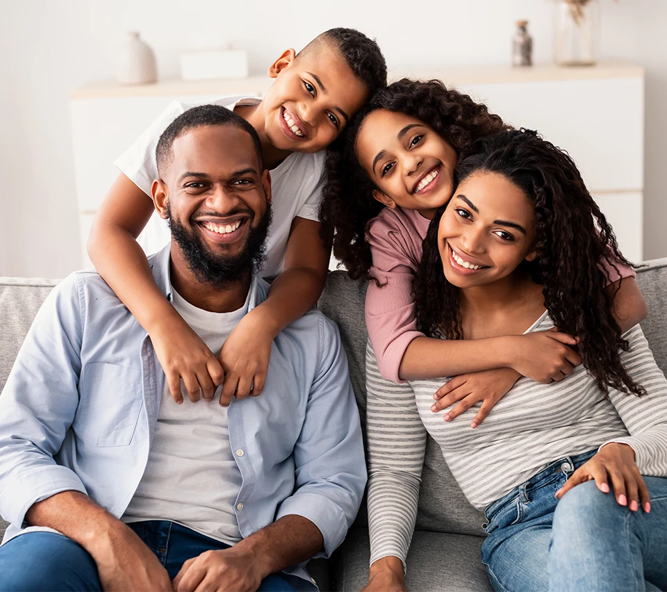 Happy family, with great teeth. Image for the services page on Smiles Dental.